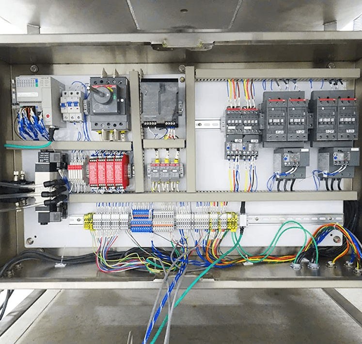 Electrical control panel with organized wiring and components.